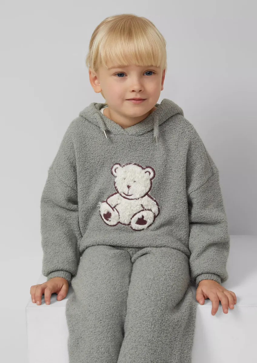 Strickpullover aus Teddy-Plüsch mit Kapuze und Front-Applikation