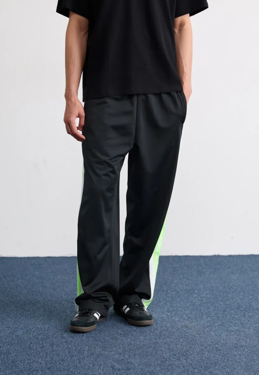ADIBREAK - Jogginghose - black/signal green