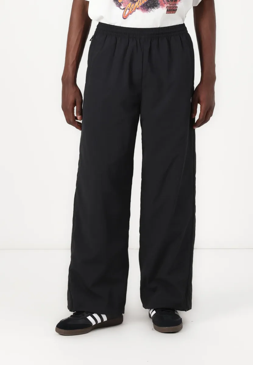 ADILENIUM SEASONAL 3 OVERSIZED SUPERSTAR TRACK - Jogginghose - black
