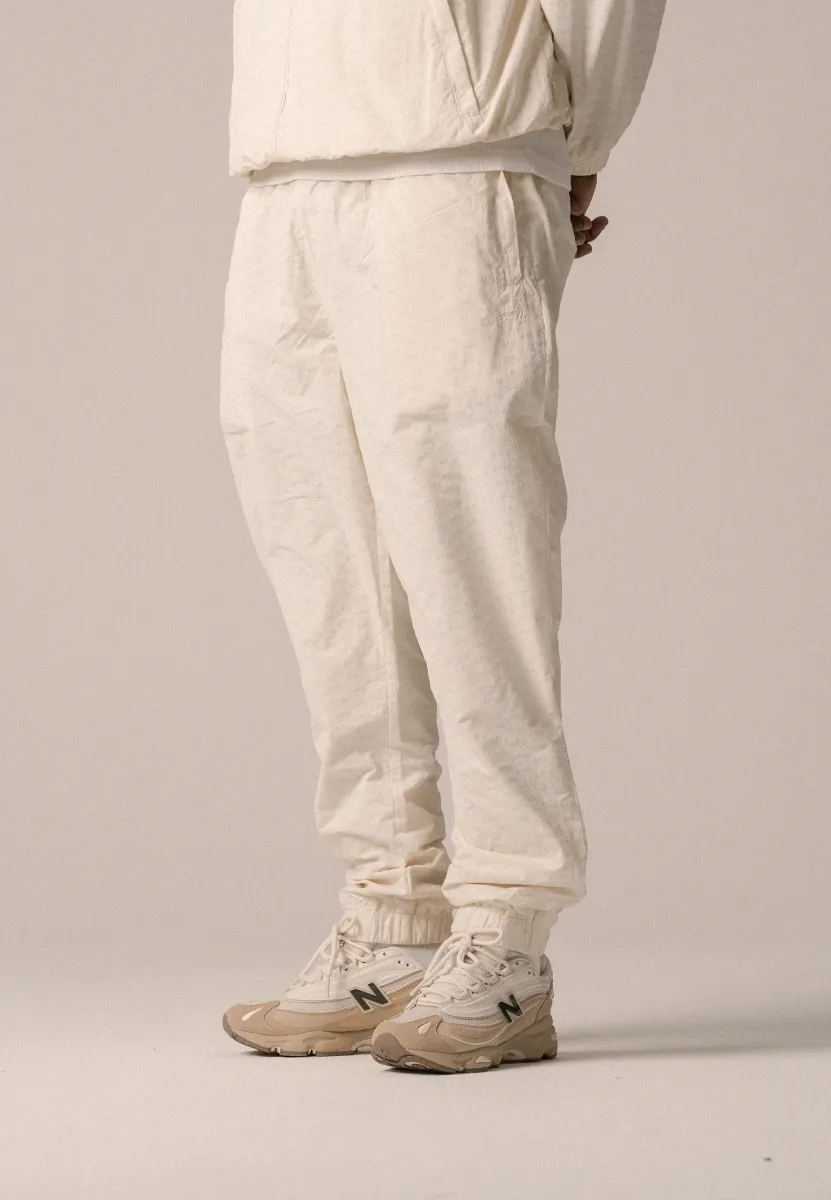 ALLOVER TRACK PANTS UNISEX - Jogginghose - antique white