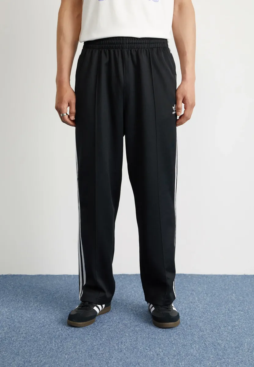 BAGGY - Jogginghose - black
