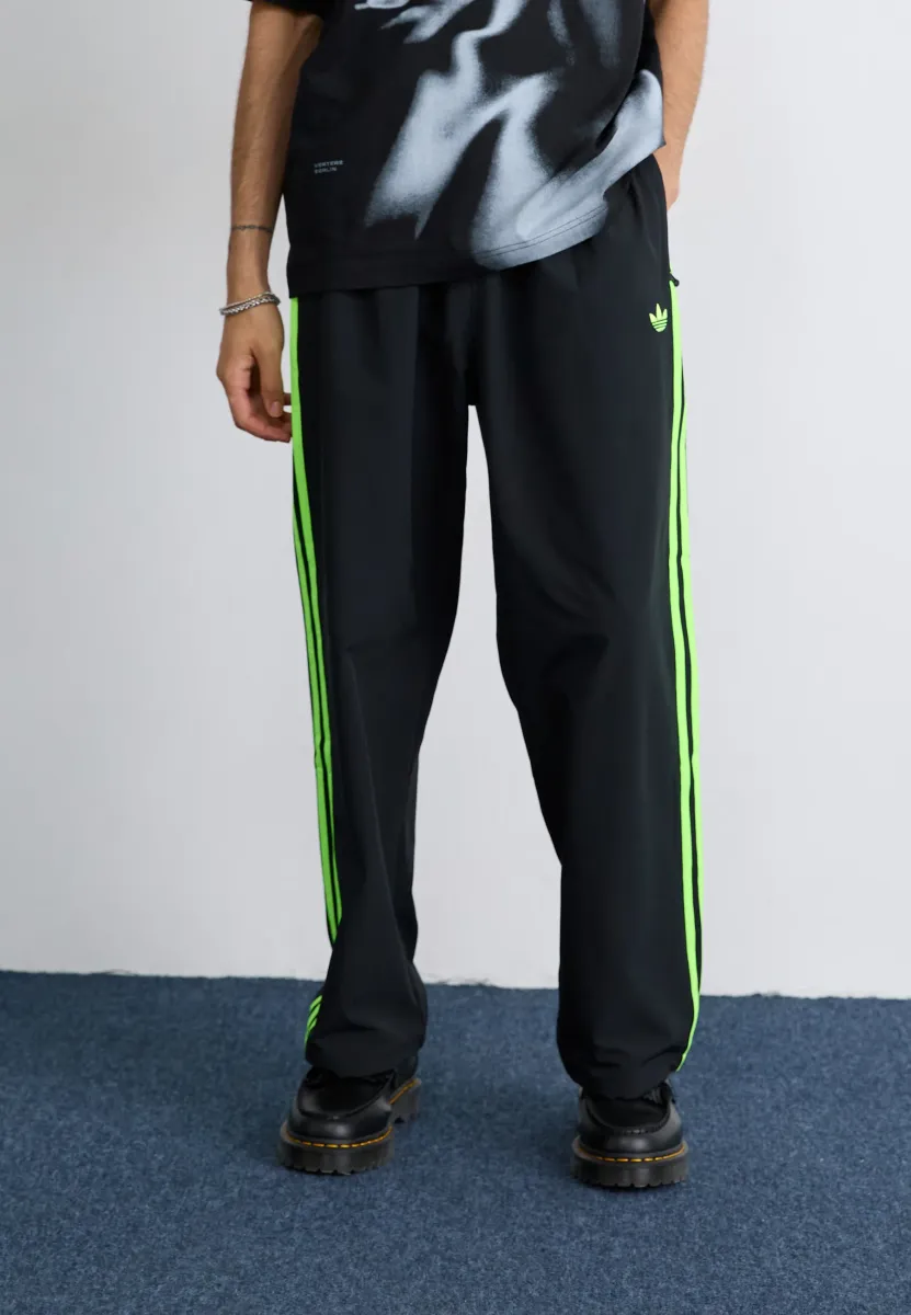 DRILL - Jogginghose - black/signal green