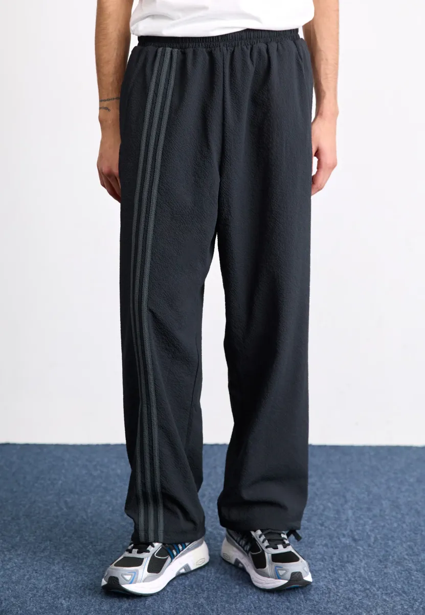 FASHION SEERSUCKER FIREBIRD TRACK LOOSE - Jogginghose - black
