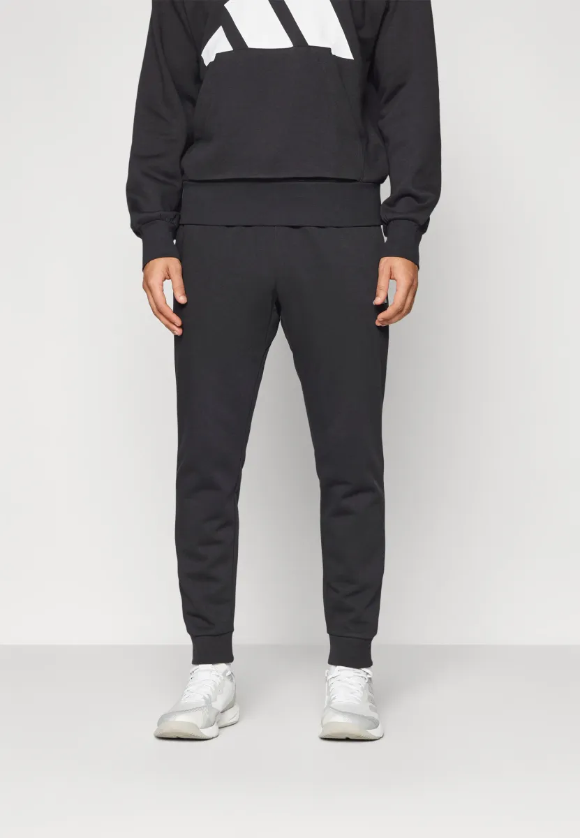 FEELCOZY - Jogginghose - black/white