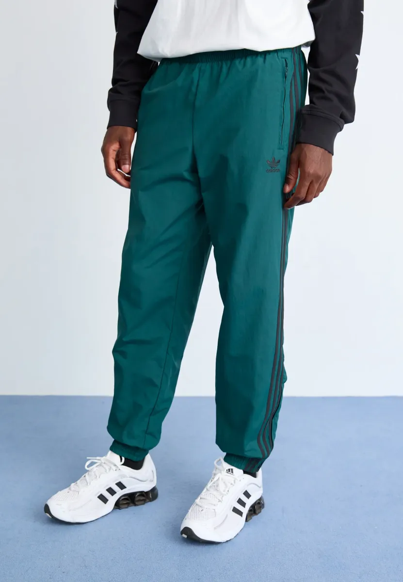FIREBIRD PANTS - Jogginghose - aurora ivy/black