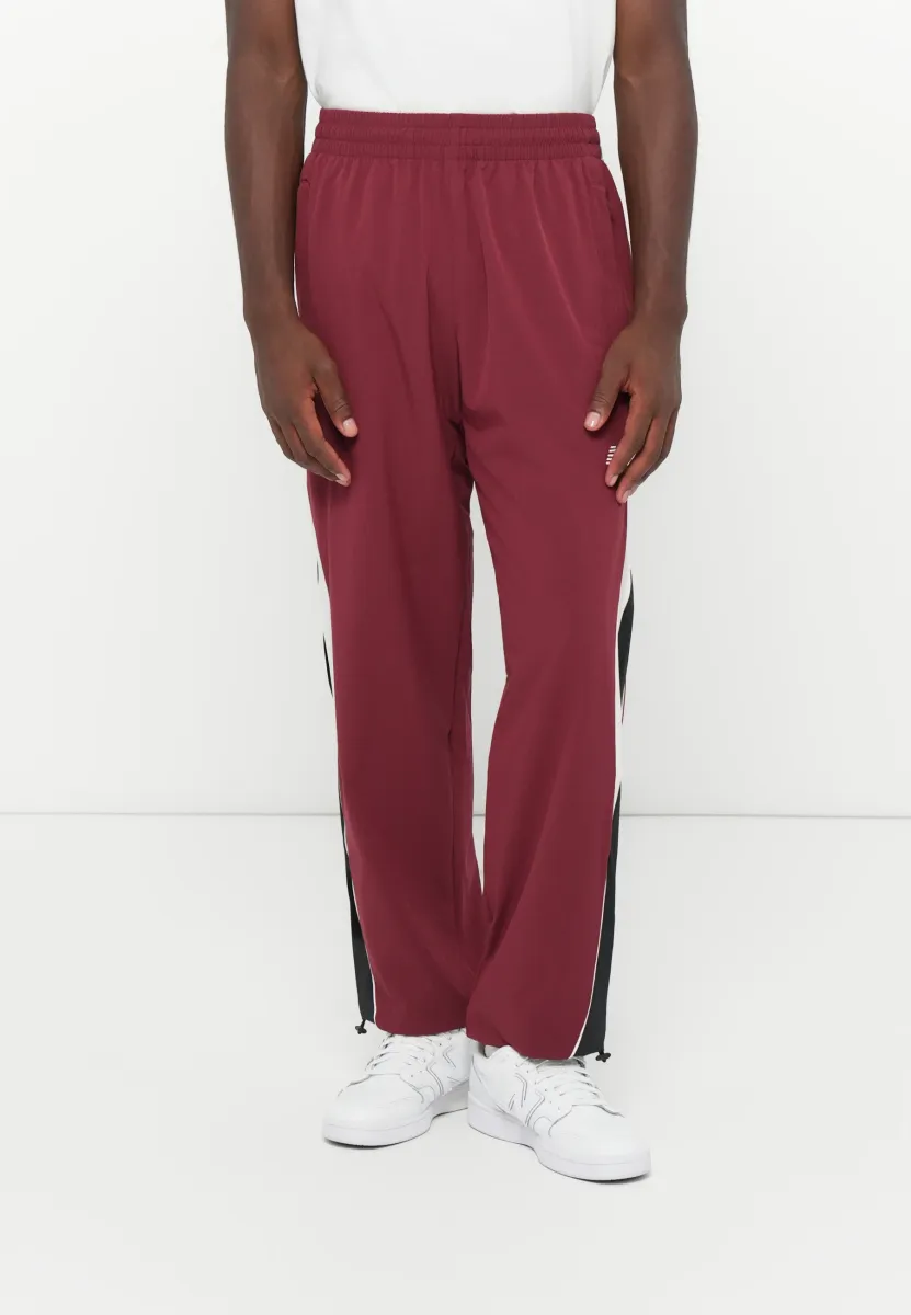 IN GAME TRACK PANT - Jogginghose - red