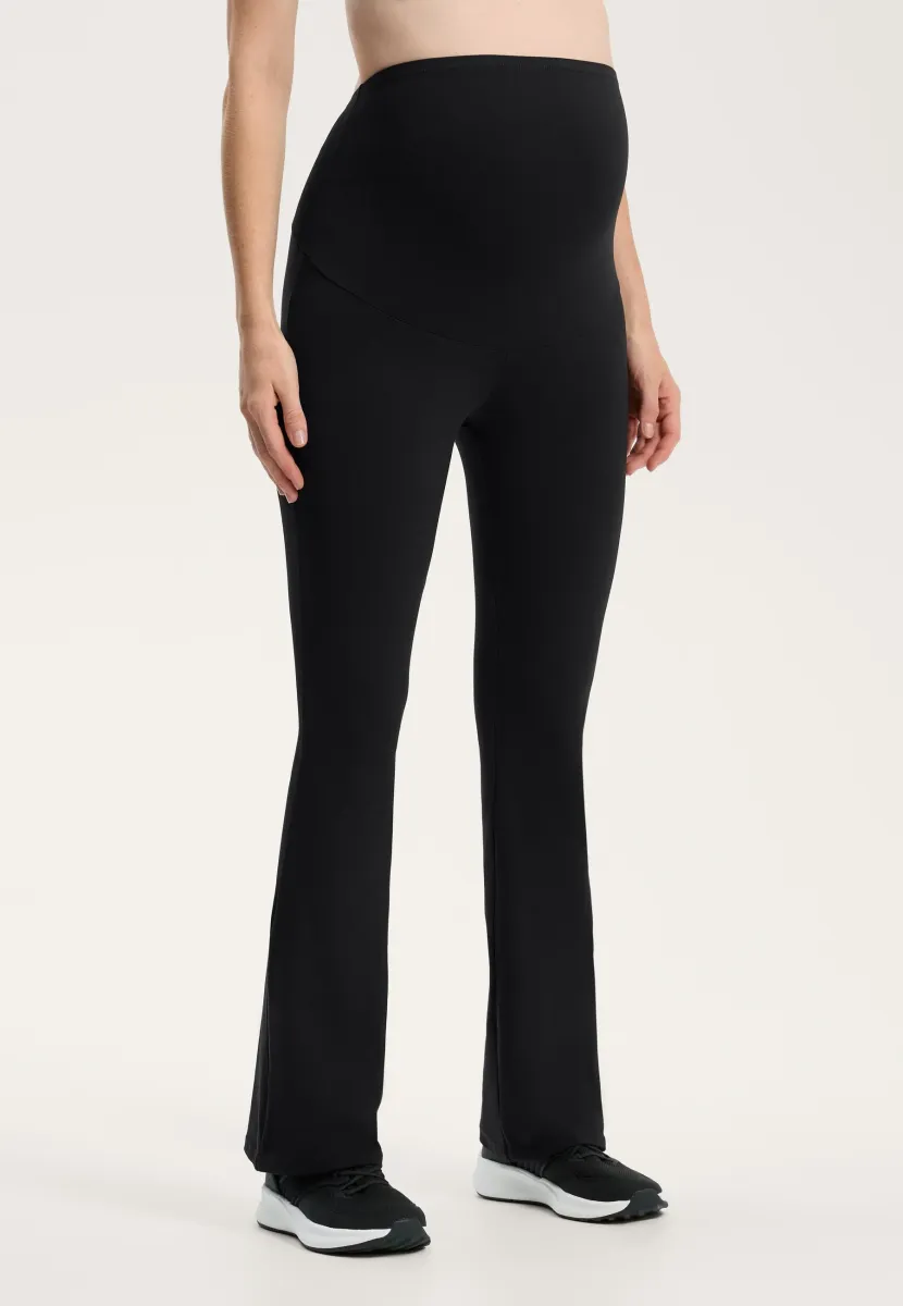 MATERNITY COMFORTLUX 80cm FLARE - Stoffhose - black