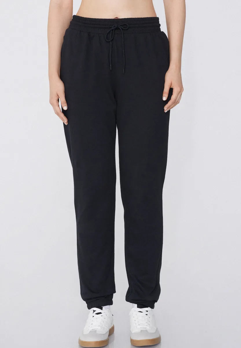 MIT PASPELTASCHEN UND TUNNELZUG - Jogginghose - nero