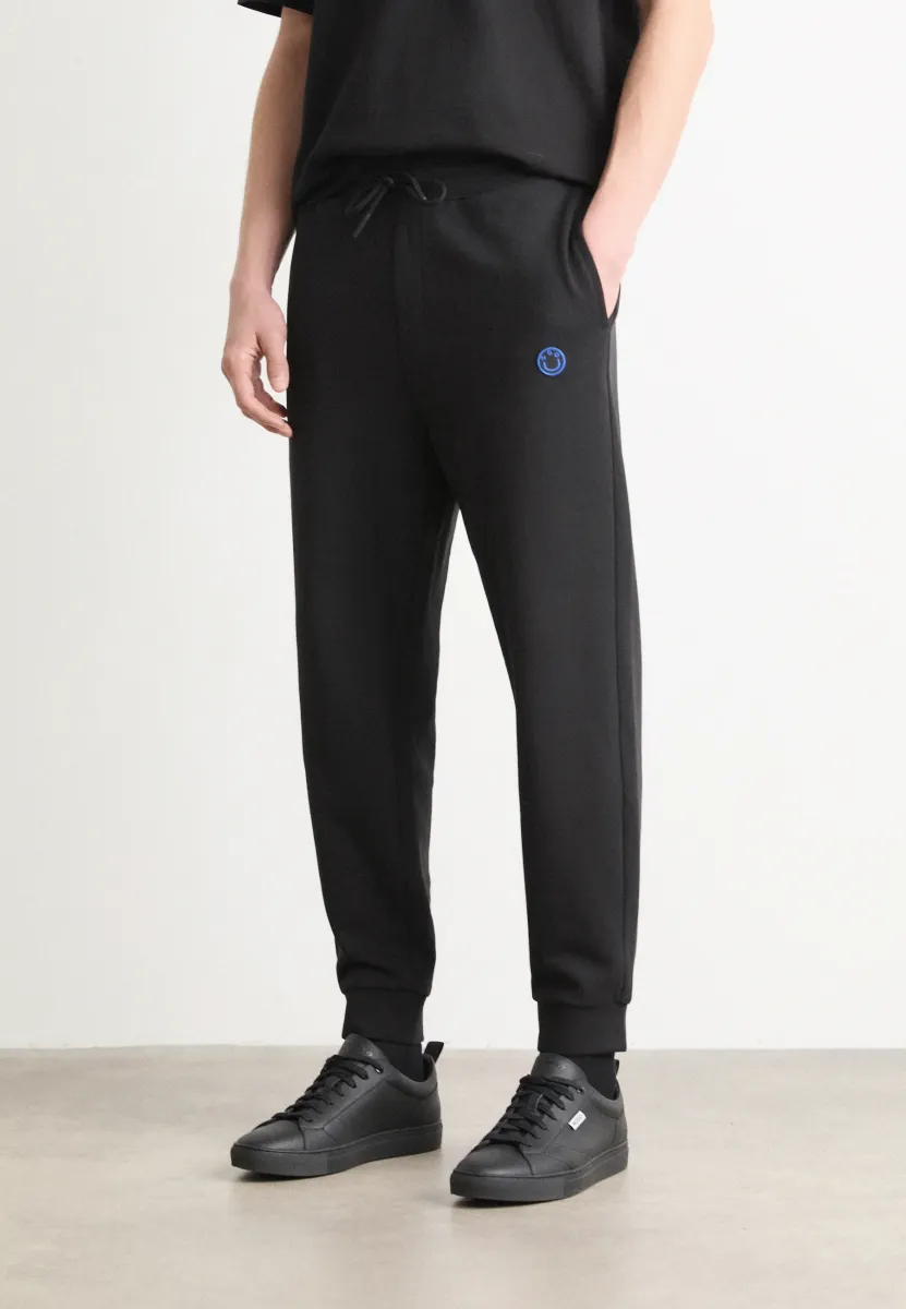 NOMPIO - Jogginghose - black