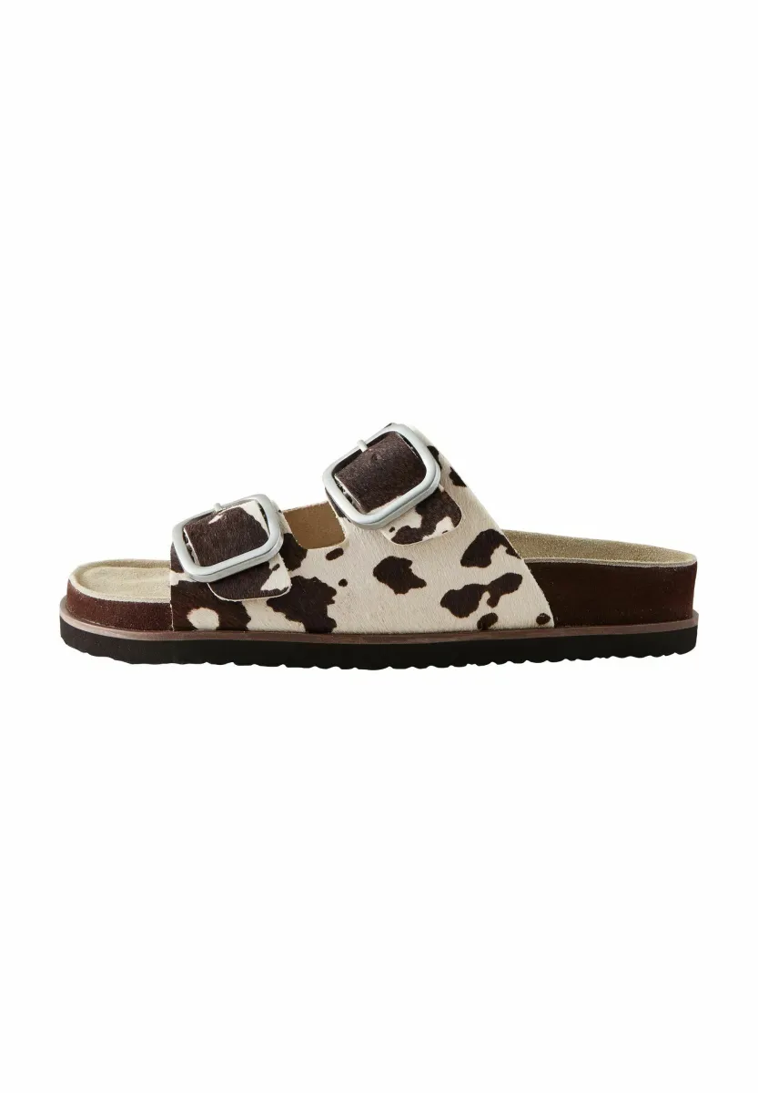 Pantolette flach - animal cow print leather