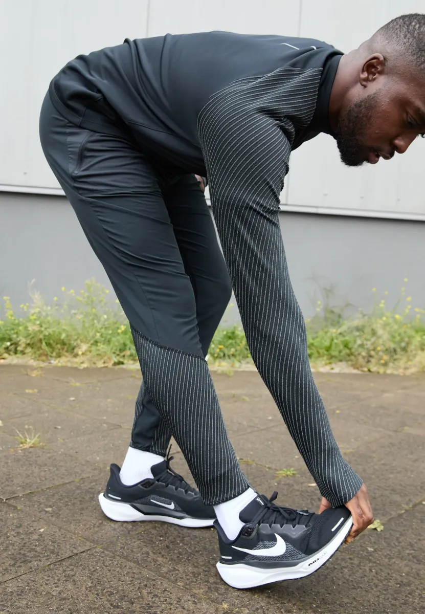 REFLECT PANT - Jogginghose - black