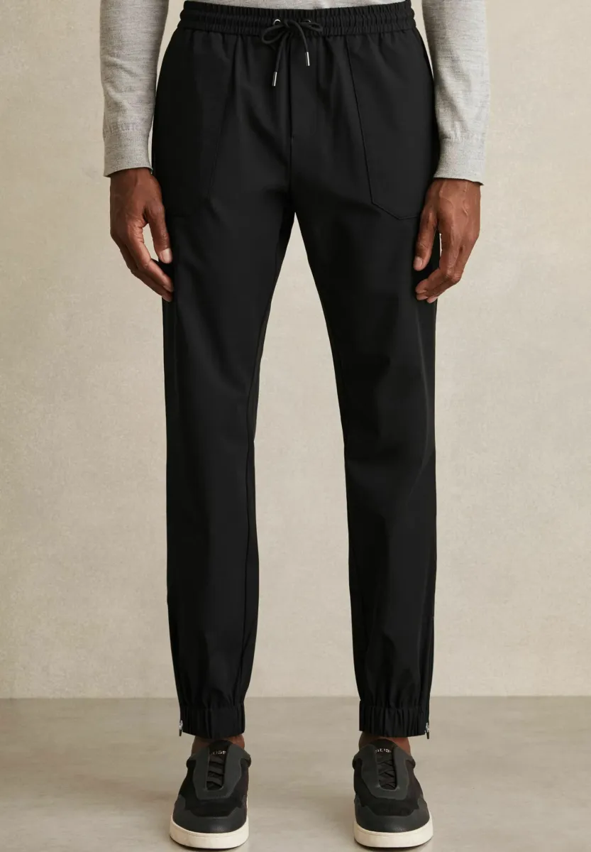 REGULAR FIT - CLIMB TECHNICAL CUFFED  - Jogginghose - black