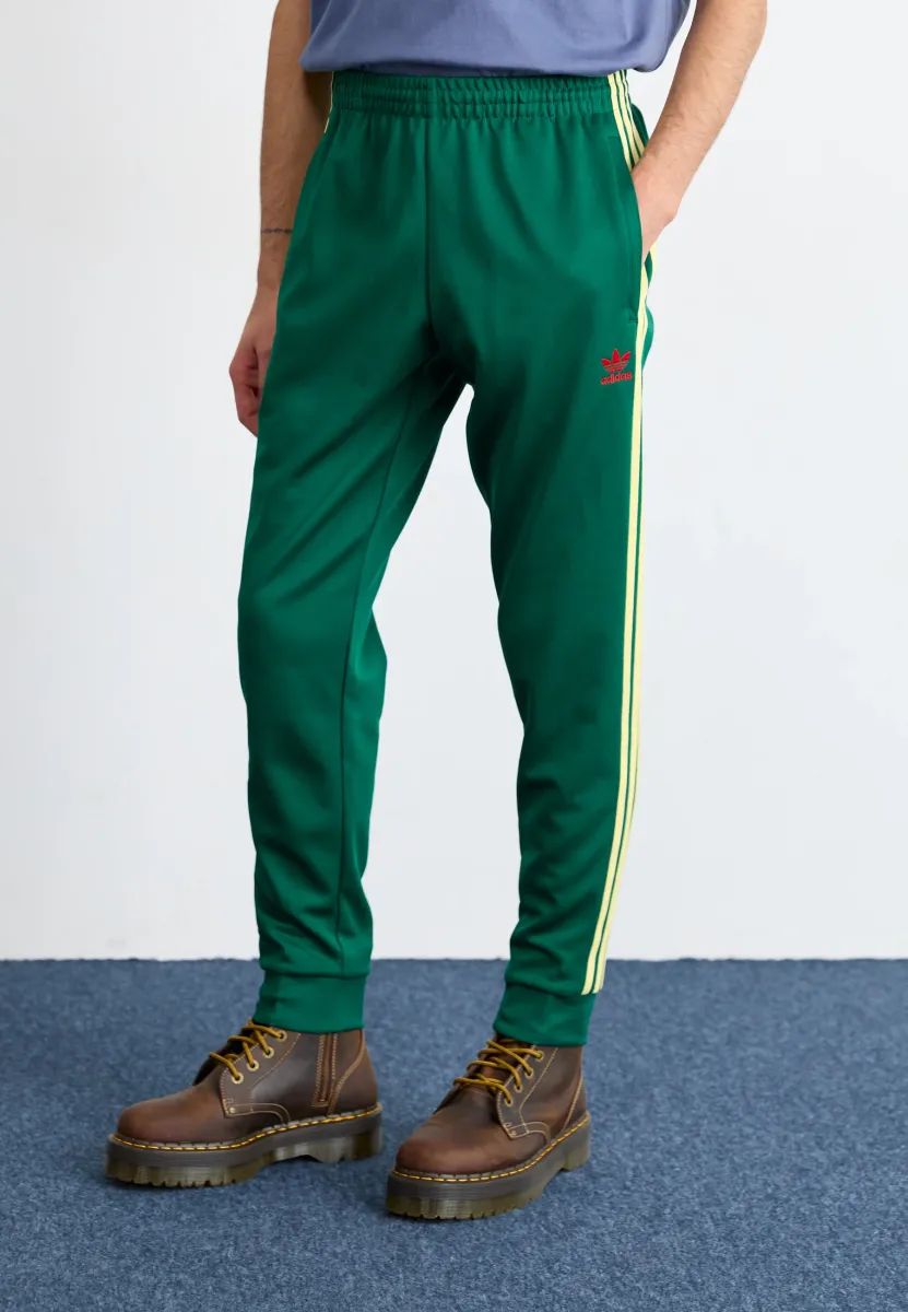 SST TP - Jogginghose - collegiate green/powder yellow