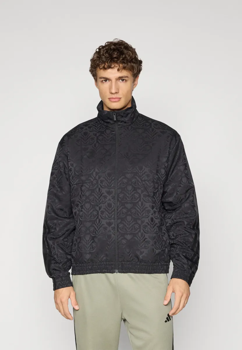 TIRO - Trainingsjacke - black