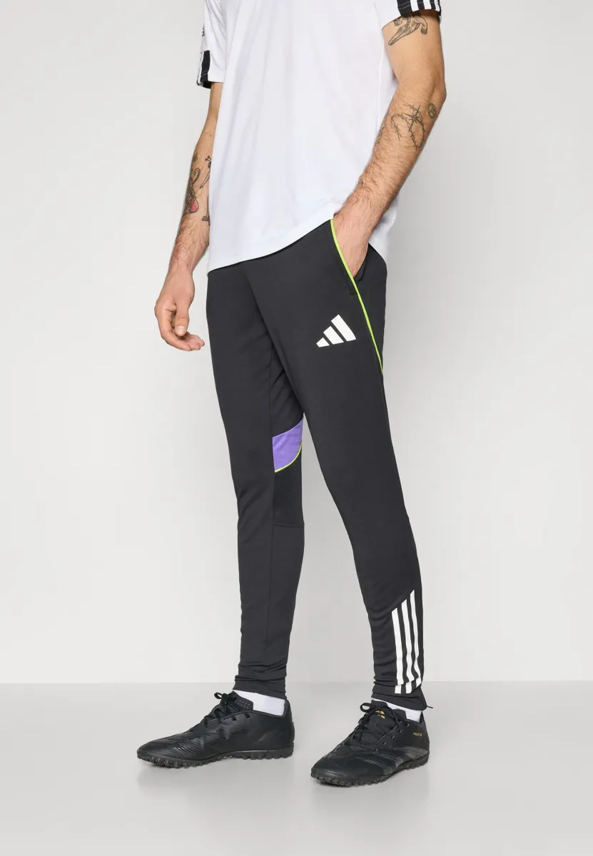 TIRO25C TRAINING PANT - Jogginghose - black/purple rush