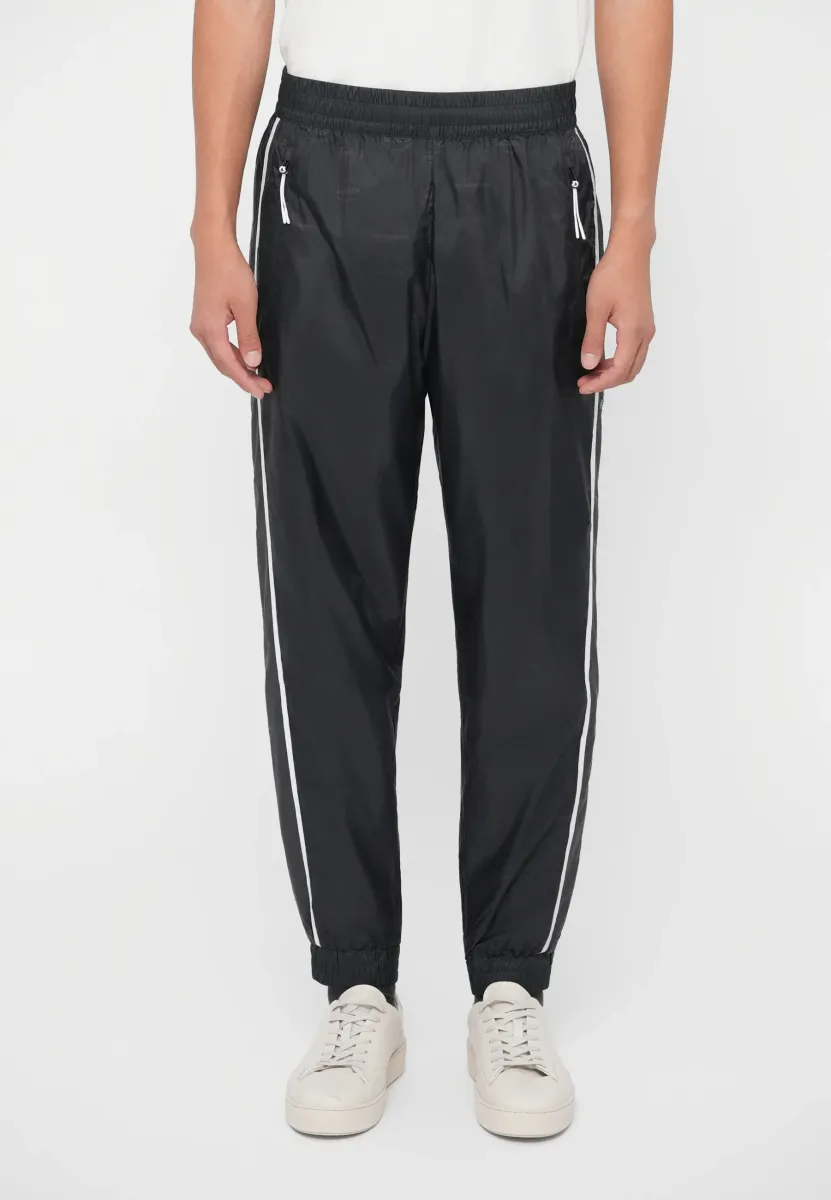 TRAIN GRAPHIC SERIES PANTS MONOGRAM - Jogginghose - black fancy